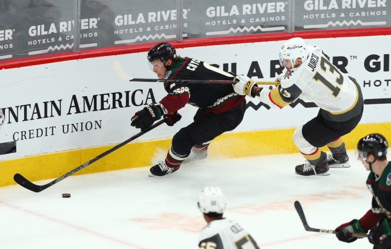 Apr 30, 2021; Glendale, Arizona, USA; Arizona Coyotes defenseman Jakob Chychrun (6) skates with the puck against Vegas Golden Knights right winger Tomas Jurco (13) in the first period at Gila River Arena. Mandatory Credit: Billy Hardiman-USA TODAY Sports