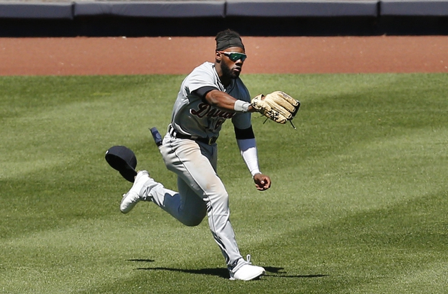 May 1, 2021; Bronx, New York, USA; Detroit Tigers left fielder Akil Baddoo (60) makes a running catch against the New York Yankees during the third inning at Yankee Stadium. Mandatory Credit: Andy Marlin-USA TODAY Sports