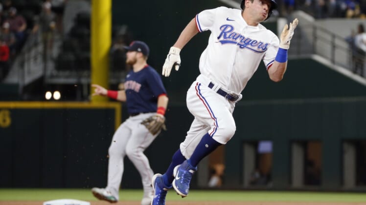May 1, 2021; Arlington, Texas, USA; Texas Rangers second baseman Nick Solak rounds second base on a single by Texas Rangers center fielder Joey Gallo during the first inning against the Boston Red Sox at Globe Life Field. Mandatory Credit: Raymond Carlin III-USA TODAY Sports