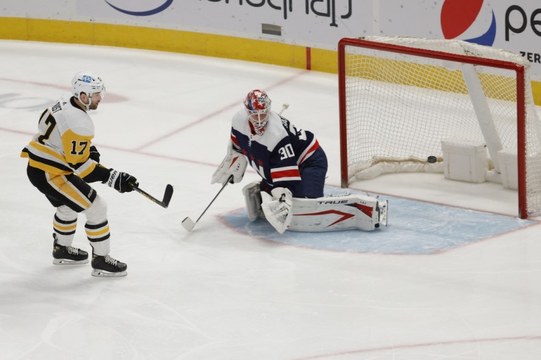 May 1, 2021; Washington, District of Columbia, USA; Pittsburgh Penguins right wing Bryan Rust (17) scores a goal on Washington Capitals goaltender Ilya Samsonov (30) in the first period at Capital One Arena. Mandatory Credit: Geoff Burke-USA TODAY Sports