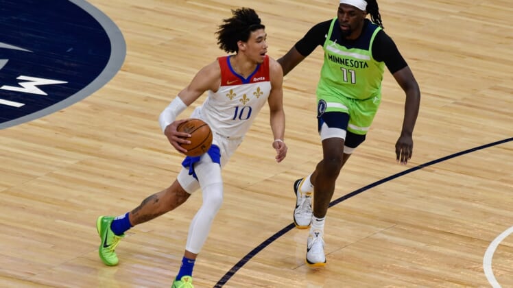 May 1, 2021; Minneapolis, Minnesota, USA; New Orleans Pelicans center Jaxson Hayes (10) controls the ball as Minnesota Timberwolves center Naz Reid (11) defends during the first quarter at Target Center. Mandatory Credit: Jeffrey Becker-USA TODAY Sports