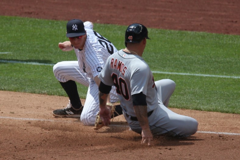 May 2, 2021; Bronx, New York, USA; Detroit Tigers catcher Wilson Ramos (40) takes third base ahead of a tag by New York Yankees third baseman DJ LeMahieu (26) on a wild pitch by Yankees starting pitcher Corey Kluber (not pictured) during the third inning at Yankee Stadium. Mandatory Credit: Brad Penner-USA TODAY Sports