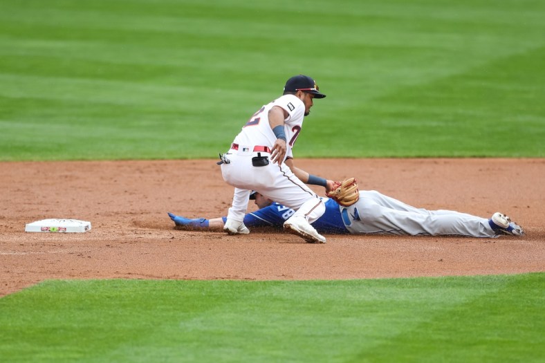May 2, 2021; Minneapolis, Minnesota, USA; Minnesota Twins second baseman Luis Arraez (2) tags out Kansas City Royals left fielder Andrew Benintendi (16) on a steal attempt in the second inning at Target Field. Mandatory Credit: David Berding-USA TODAY Sports