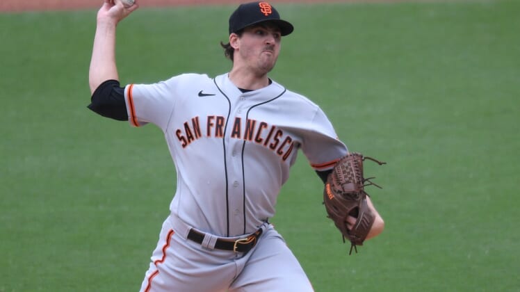 May 2, 2021; San Diego, California, USA; San Francisco Giants starting pitcher Kevin Gausman (34) pitches against the San Diego Padres during the fifth inning at Petco Park. Mandatory Credit: Orlando Ramirez-USA TODAY Sports