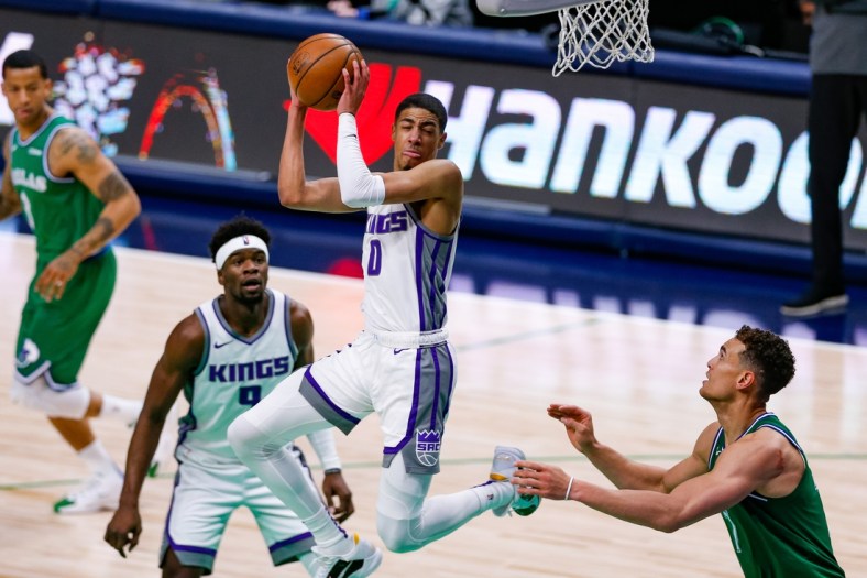 May 2, 2021; Dallas, Texas, USA; Sacramento Kings guard Tyrese Haliburton (0) grabs a rebound during the second quarter against the Dallas Mavericks at American Airlines Center. Mandatory Credit: Andrew Dieb-USA TODAY Sports