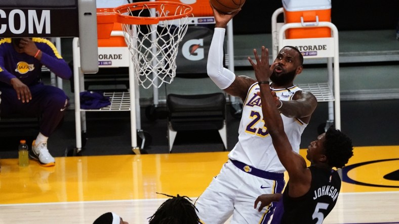 May 2, 2021; Los Angeles, California, USA; Los Angeles Lakers forward LeBron James (23) shoots against Toronto Raptors forward Stanley Johnson (5) during the first half at Staples Center. Mandatory Credit: Gary A. Vasquez-USA TODAY Sports