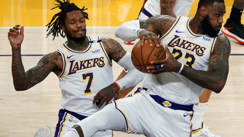 May 2, 2021; Los Angeles, California, USA; Los Angeles Lakers forward LeBron James (23) gets a rebound in front of guard Ben McLemore (7) against the Toronto Raptors  during the second half at Staples Center. Mandatory Credit: Gary A. Vasquez-USA TODAY Sports