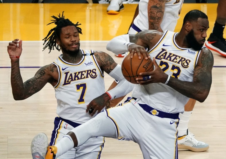 May 2, 2021; Los Angeles, California, USA; Los Angeles Lakers forward LeBron James (23) gets a rebound in front of guard Ben McLemore (7) against the Toronto Raptors  during the second half at Staples Center. Mandatory Credit: Gary A. Vasquez-USA TODAY Sports