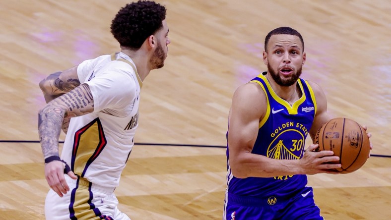 May 3, 2021; New Orleans, Louisiana, USA; Golden State Warriors guard Stephen Curry (30) drives to the basket against New Orleans Pelicans guard Lonzo Ball (2) during the first half at the Smoothie King Center. Mandatory Credit: Stephen Lew-USA TODAY Sports