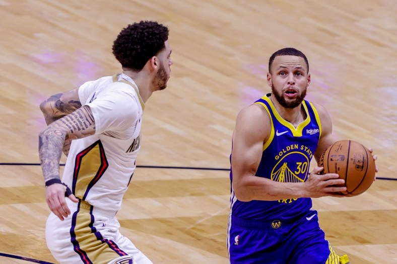 May 3, 2021; New Orleans, Louisiana, USA; Golden State Warriors guard Stephen Curry (30) drives to the basket against New Orleans Pelicans guard Lonzo Ball (2) during the first half at the Smoothie King Center. Mandatory Credit: Stephen Lew-USA TODAY Sports