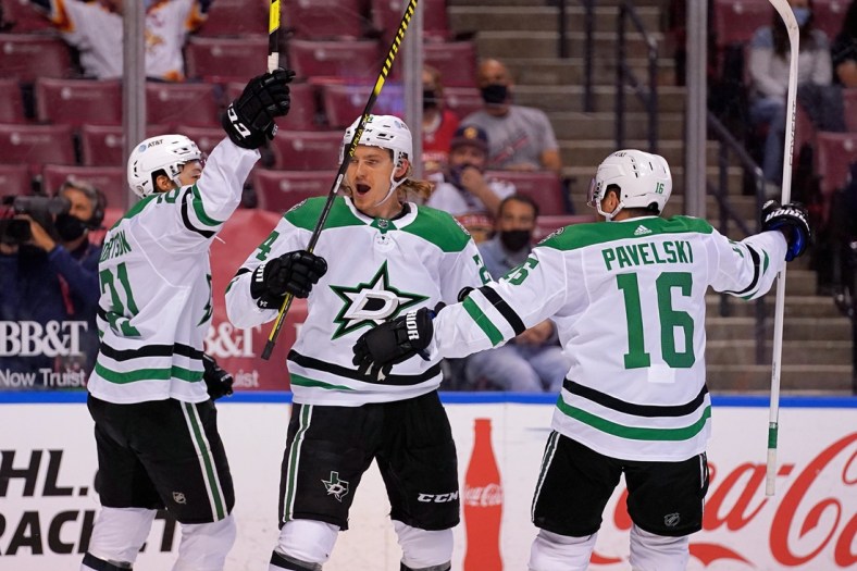 May 3, 2021; Sunrise, Florida, USA; Dallas Stars left wing Jason Robertson (21) celebrates his goal against the Florida Panthers with left wing Roope Hintz (24) and center Joe Pavelski (16) during the first period at BB&T Center. Mandatory Credit: Jasen Vinlove-USA TODAY Sports