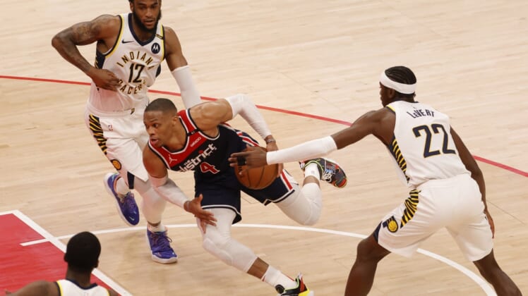 May 3, 2021; Washington, District of Columbia, USA; Washington Wizards guard Russell Westbrook (4) drives to the basket past Indiana Pacers guard Caris LeVert (22) in the second quarter at Capital One Arena. Mandatory Credit: Geoff Burke-USA TODAY Sports