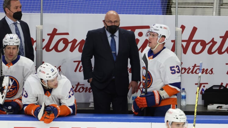 May 3, 2021; Buffalo, New York, USA;  New York Islanders head coach Barry Trotz watches his team during the second period against the Buffalo Sabres at KeyBank Center. Mandatory Credit: Timothy T. Ludwig-USA TODAY Sports