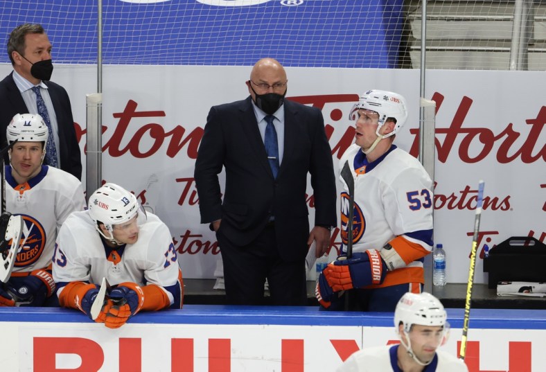 May 3, 2021; Buffalo, New York, USA;  New York Islanders head coach Barry Trotz watches his team during the second period against the Buffalo Sabres at KeyBank Center. Mandatory Credit: Timothy T. Ludwig-USA TODAY Sports