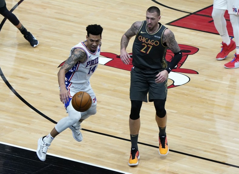 May 3, 2021; Chicago, Illinois, USA; Philadelphia 76ers forward Danny Green (14) attempts to save a loose ball from going out against Chicago Bulls center Daniel Theis (27) during the first quarter at the United Center. Mandatory Credit: Mike Dinovo-USA TODAY Sports