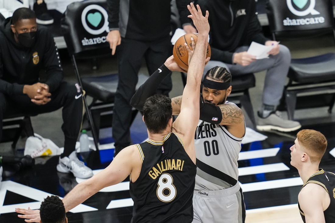 May 3, 2021; Atlanta, Georgia, USA; Portland Trail Blazers forward Carmelo Anthony (00) is defended by Atlanta Hawks forward Danilo Gallinari (8) during the second half at State Farm Arena. Mandatory Credit: Dale Zanine-USA TODAY Sports