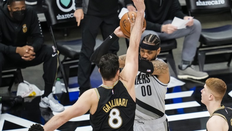 May 3, 2021; Atlanta, Georgia, USA; Portland Trail Blazers forward Carmelo Anthony (00) is defended by Atlanta Hawks forward Danilo Gallinari (8) during the second half at State Farm Arena. Mandatory Credit: Dale Zanine-USA TODAY Sports