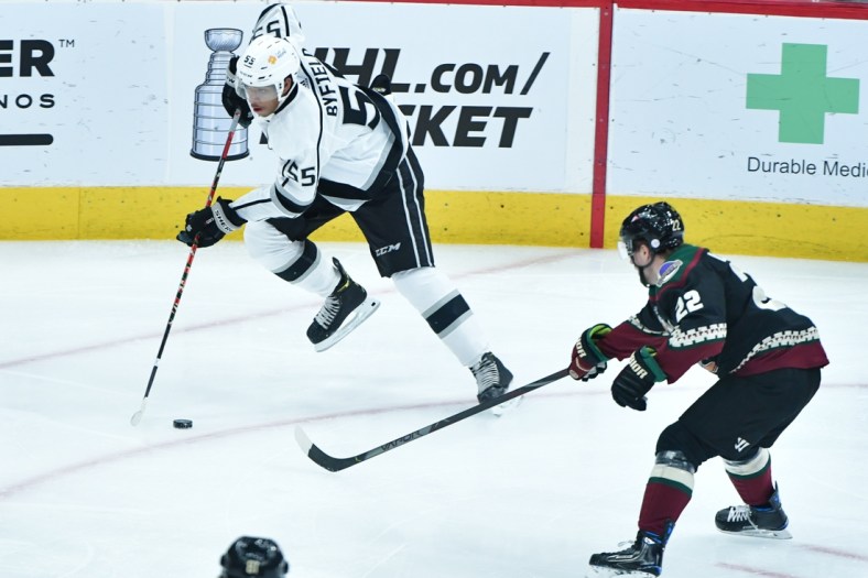 May 3, 2021; Glendale, Arizona, USA; Los Angeles Kings center Quinton Byfield (55) carries the puck as Arizona Coyotes left wing Johan Larsson (22) defends during the first period at Gila River Arena. Mandatory Credit: Matt Kartozian-USA TODAY Sports