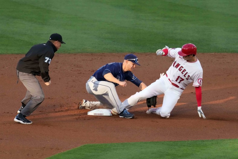 May 3, 2021; Anaheim, California, USA; Los Angeles Angels designated hitter Shohei Ohtani (17) slides into second base to beat a throw to Tampa Bay Rays second baseman Mike Brosseau (43) on a double in the first inning at Angel Stadium. Mandatory Credit: Kirby Lee-USA TODAY Sports
