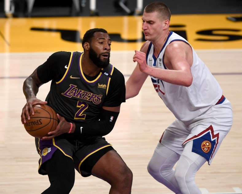 May 3, 2021; Los Angeles, California, USA; Los Angeles Lakers center Andre Drummond (2) is defended by Denver Nuggets center Nikola Jokic (15) in the first quarter of the game at Staples Center. Mandatory Credit: Jayne Kamin-Oncea-USA TODAY Sports