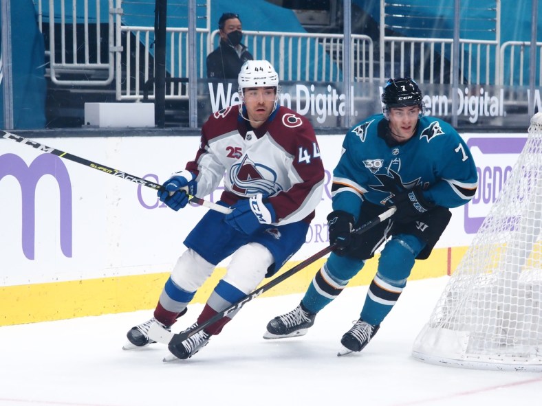 May 3, 2021; San Jose, California, USA; Colorado Avalanche left wing Kiefer Sherwood (44) and San Jose Sharks center Dylan Gambrell (7) chase down the puck during the first period at SAP Center at San Jose. Mandatory Credit: Kelley L Cox-USA TODAY Sports