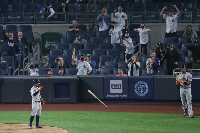May 4, 2021; Bronx, New York, USA; Yankees fans react as Houston Astros second baseman Jose Altuve (27) tosses his bat away after striking out to end the top of the third inning against the New York Yankees at Yankee Stadium. Mandatory Credit: Brad Penner-USA TODAY Sports