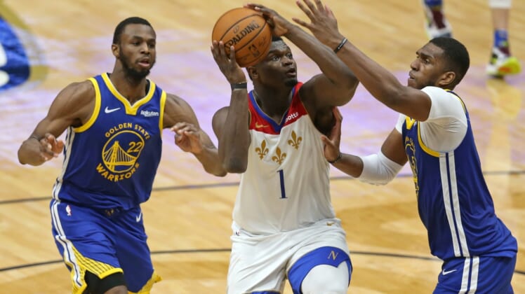 May 4, 2021; New Orleans, Louisiana, USA; New Orleans Pelicans forward Zion Williamson (1) drives on  Golden State Warriors forward Kevon Looney (5) in the third quarter at the Smoothie King Center. Mandatory Credit: Chuck Cook-USA TODAY Sports