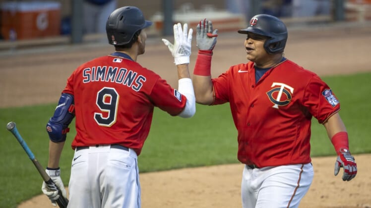 May 4, 2021; Minneapolis, Minnesota, USA; Minnesota Twins first baseman Willians Astudillo (64) celebrates with shortstop Andrelton Simmons (9) after hitting a solo home run in the fifth inning against the Texas Rangers at Target Field. Mandatory Credit: Jesse Johnson-USA TODAY Sports