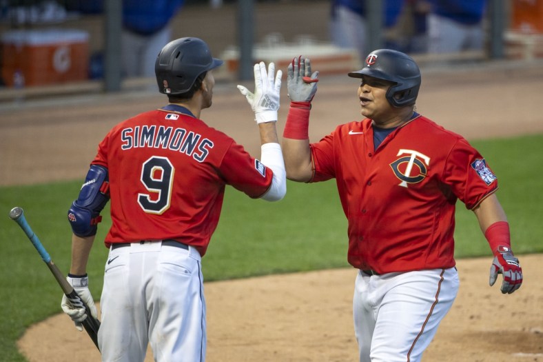 May 4, 2021; Minneapolis, Minnesota, USA; Minnesota Twins first baseman Willians Astudillo (64) celebrates with shortstop Andrelton Simmons (9) after hitting a solo home run in the fifth inning against the Texas Rangers at Target Field. Mandatory Credit: Jesse Johnson-USA TODAY Sports