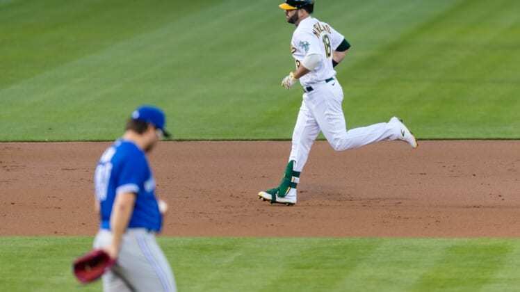 May 4, 2021; Oakland, California, USA; Oakland Athletics designated hitter Mitch Moreland (18) runs the bases after hitting a two-run home run against the Toronto Blue Jays in the second inning at RingCentral Coliseum. Mandatory Credit: John Hefti-USA TODAY Sports