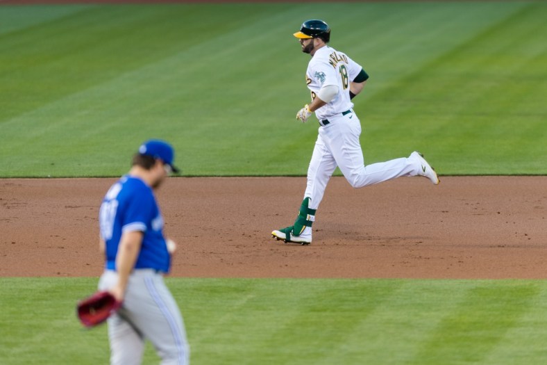 May 4, 2021; Oakland, California, USA; Oakland Athletics designated hitter Mitch Moreland (18) runs the bases after hitting a two-run home run against the Toronto Blue Jays in the second inning at RingCentral Coliseum. Mandatory Credit: John Hefti-USA TODAY Sports
