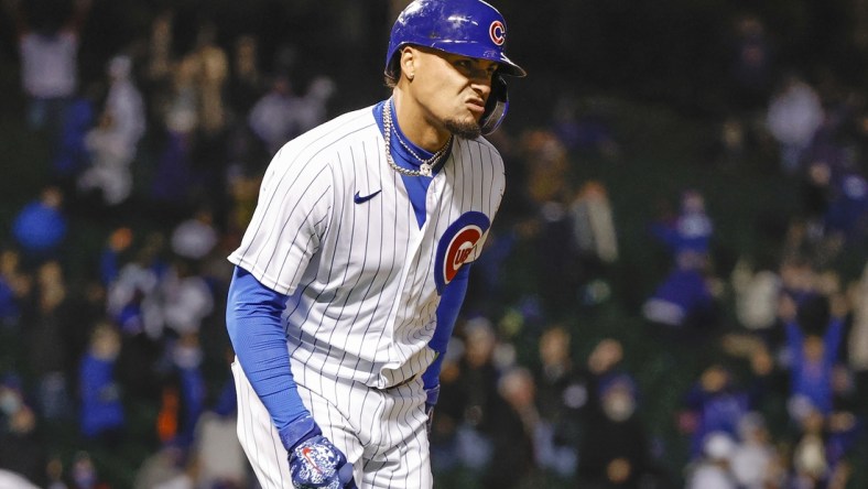 May 4, 2021; Chicago, Illinois, USA; Chicago Cubs shortstop Javier Baez (9) reacts after hitting a two-run home run against the Los Angeles Dodgers during the eight inning of the second game of a doubleheader at Wrigley Field. Mandatory Credit: Kamil Krzaczynski-USA TODAY Sports