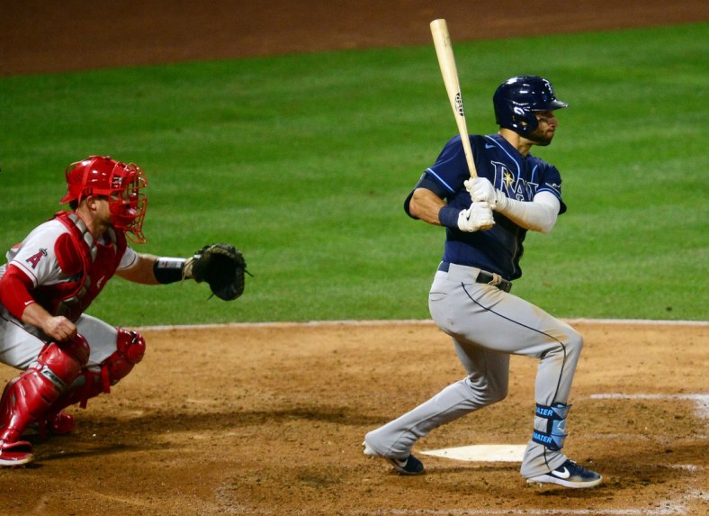 May 4, 2021; Anaheim, California, USA; Tampa Bay Rays center fielder Kevin Kiermaier (39) hits a two run RBI double against the Los Angeles Angels during the sixth inning at Angel Stadium. Mandatory Credit: Gary A. Vasquez-USA TODAY Sports