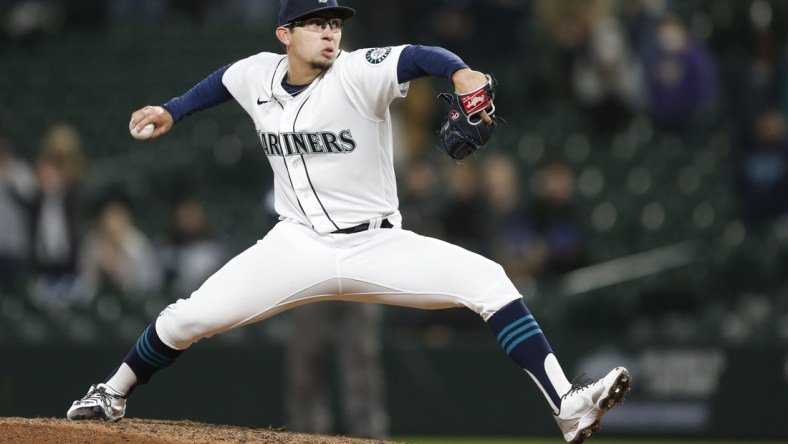 May 4, 2021; Seattle, Washington, USA; Seattle Mariners relief pitcher Robert Dugger (30) throws a pitch against the Baltimore Orioles during the ninth inning at T-Mobile Park. Mandatory Credit: Joe Nicholson-USA TODAY Sports