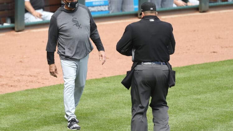 May 5, 2021; Cincinnati, Ohio, USA; Chicago White Sox manager Tony La Russa (left) talks with home plate umpire Sam Holbrook (right) during the ninth inning against the Cincinnati Reds at Great American Ball Park. Mandatory Credit: David Kohl-USA TODAY Sports