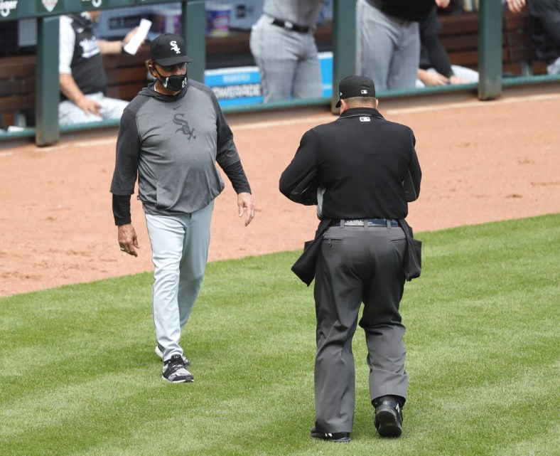 May 5, 2021; Cincinnati, Ohio, USA; Chicago White Sox manager Tony La Russa (left) talks with home plate umpire Sam Holbrook (right) during the ninth inning against the Cincinnati Reds at Great American Ball Park. Mandatory Credit: David Kohl-USA TODAY Sports