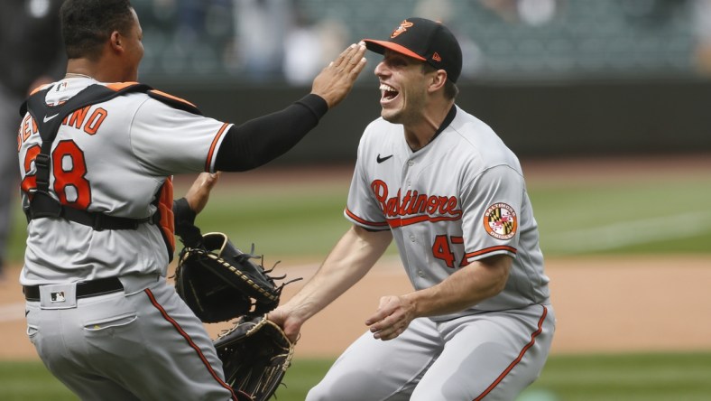 May 5, 2021; Seattle, Washington, USA; Baltimore Orioles starting pitcher John Means (47) and catcher Pedro Severino (28) celebrate following the final out of a no-hit 6-0 victory against the Seattle Mariners at T-Mobile Park. Mandatory Credit: Joe Nicholson-USA TODAY Sports