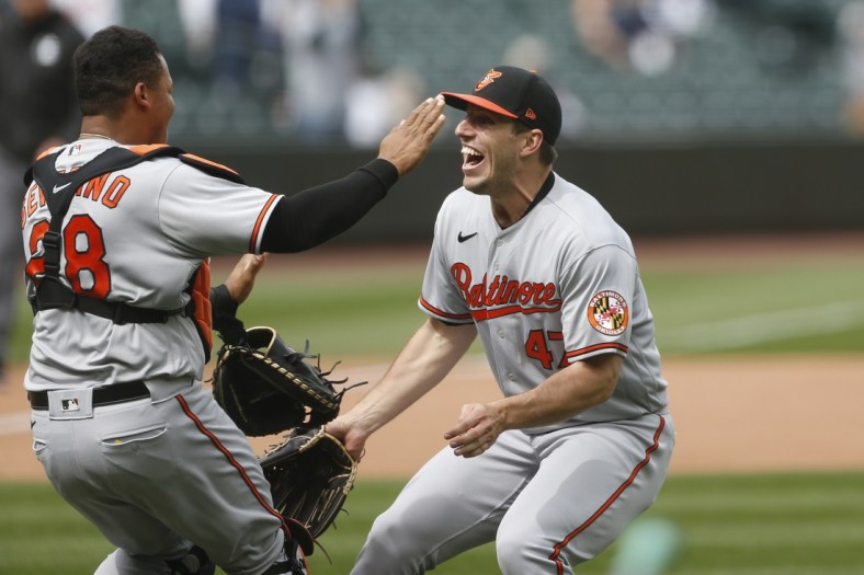 May 5, 2021; Seattle, Washington, USA; Baltimore Orioles starting pitcher John Means (47) and catcher Pedro Severino (28) celebrate following the final out of a no-hit 6-0 victory against the Seattle Mariners at T-Mobile Park. Mandatory Credit: Joe Nicholson-USA TODAY Sports