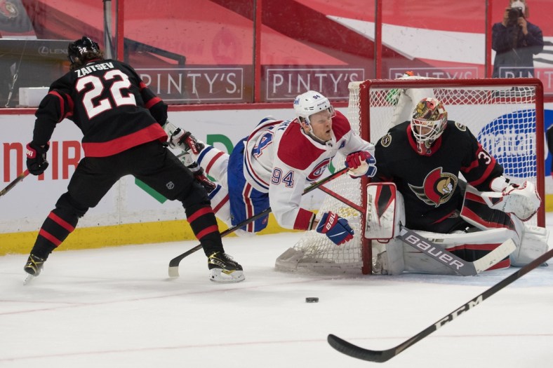 May 5, 2021; Ottawa, Ontario, CAN; Montreal Canadiens right wing Corey Perry (94) falls and loses control of the puck in front of Ottawa Senators goalie Anton Forsberg (31) in the first period at the Canadian Tire Centre. Mandatory Credit: Marc DesRosiers-USA TODAY Sports