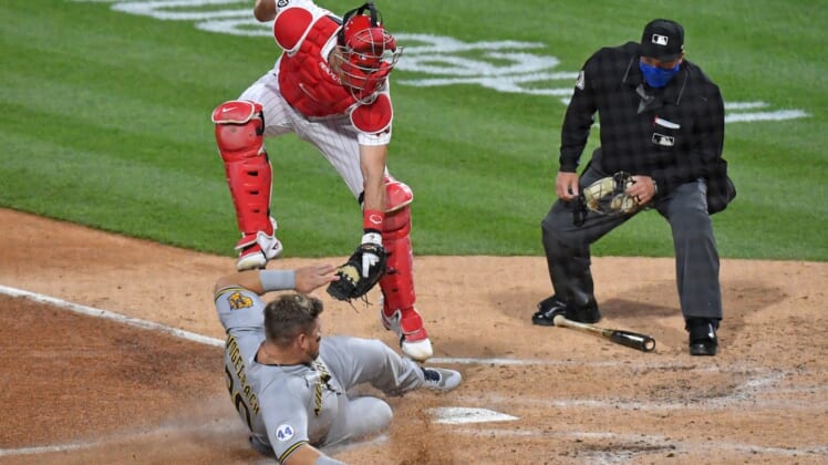 May 5, 2021; Philadelphia, Pennsylvania, USA; Philadelphia Phillies catcher J.T. Realmuto (10) tags out Milwaukee Brewers first baseman Daniel Vogelbach (20) at home during the third inning at Citizens Bank Park. Mandatory Credit: Eric Hartline-USA TODAY Sports