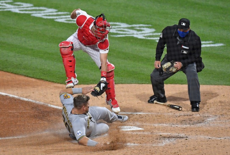May 5, 2021; Philadelphia, Pennsylvania, USA; Philadelphia Phillies catcher J.T. Realmuto (10) tags out Milwaukee Brewers first baseman Daniel Vogelbach (20) at home during the third inning at Citizens Bank Park. Mandatory Credit: Eric Hartline-USA TODAY Sports