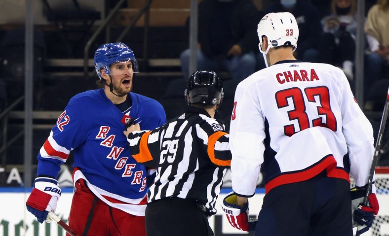 May 5, 2021; New York, New York, USA;  Brendan Smith #42 of the New York Rangers chats with Zdeno Chara #33 of the Washington Capitals during the second period at Madison Square Garden. Mandatory Credit:  Bruce Bennett/POOL PHOTOS-USA TODAY Sports