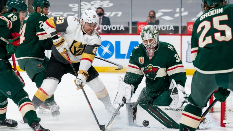 May 5, 2021; Saint Paul, Minnesota, USA; Vegas Golden Knights forward William Carrier (28) shoots against Minnesota Wild goalie Cam Talbot (33) in the first period at Xcel Energy Center. Mandatory Credit: Brad Rempel-USA TODAY Sports