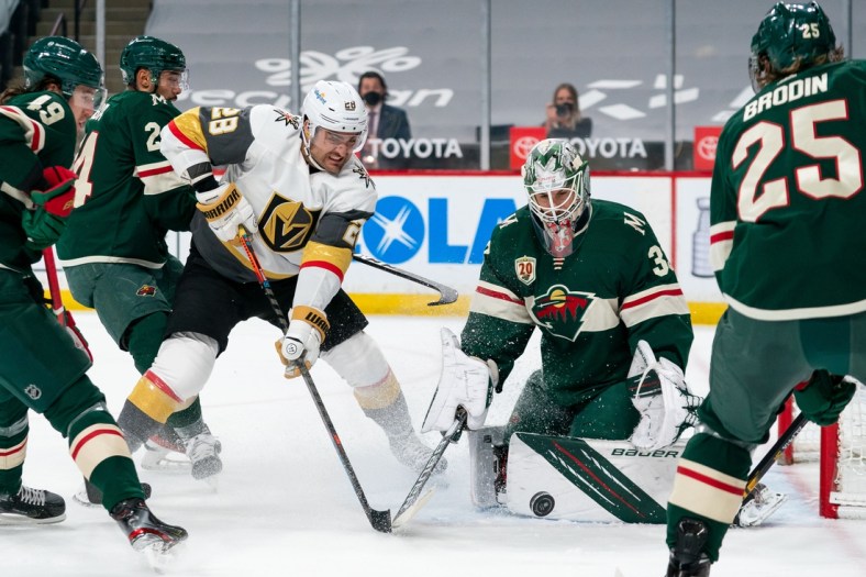 May 5, 2021; Saint Paul, Minnesota, USA; Vegas Golden Knights forward William Carrier (28) shoots against Minnesota Wild goalie Cam Talbot (33) in the first period at Xcel Energy Center. Mandatory Credit: Brad Rempel-USA TODAY Sports