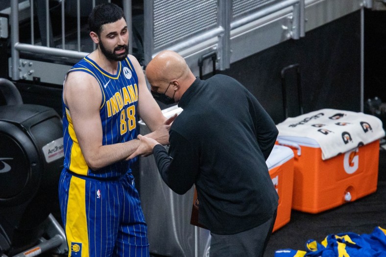 May 5, 2021; Indianapolis, Indiana, USA; Indiana Pacers center Goga Bitadze (88) tries to talk to assistant coach Greg Foster  but he walks right by after the game against the Sacramento Kings at Bankers Life Fieldhouse. Mandatory Credit: Trevor Ruszkowski-USA TODAY Sports