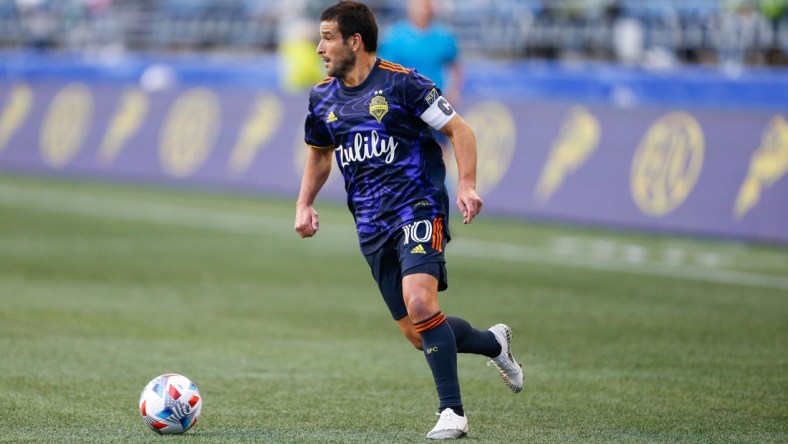 May 2, 2021; Seattle, Washington, USA; Seattle Sounders FC midfielder Nicolas Lodeiro (10) dribbles against the Los Angeles Galaxy during the second half at Lumen Field. Mandatory Credit: Jennifer Buchanan-USA TODAY Sports