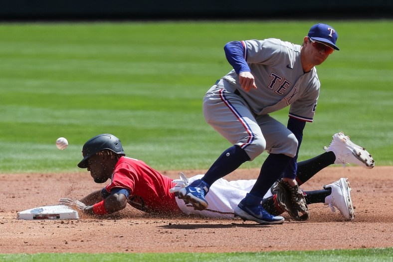 May 6, 2021; Minneapolis, Minnesota, USA; Minnesota Twins shortstop Nick Gordon (1) steals second against the Texas Rangers second baseman Nick Solak (15) in the second inning at Target Field. Mandatory Credit: Brad Rempel-USA TODAY Sports
