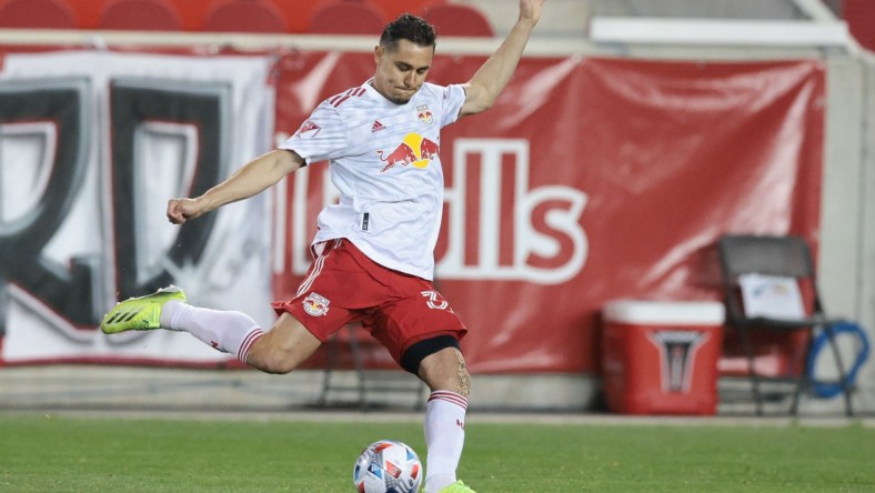 Apr 17, 2021; Harrison, New Jersey, USA;  New York Red Bulls midfielder Aaron Long (33) plays the ball against the Sporting Kansas City during the first half at Red Bull Arena. Mandatory Credit: Vincent Carchietta-USA TODAY Sports