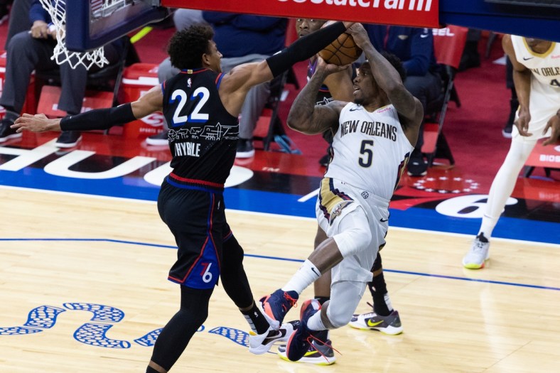 May 7, 2021; Philadelphia, Pennsylvania, USA; New Orleans Pelicans guard Eric Bledsoe (5) attempts to pass the ball pasts Philadelphia 76ers guard Matisse Thybulle (22) during the second quarter at Wells Fargo Center. Mandatory Credit: Bill Streicher-USA TODAY Sports
