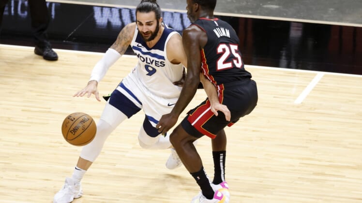 May 7, 2021; Miami, Florida, USA; Minnesota Timberwolves guard Ricky Rubio (9) dribbles the ball while defended by Miami Heat guard Kendrick Nunn (25) during the first half at American Airlines Arena. Mandatory Credit: Rhona Wise-USA TODAY Sports